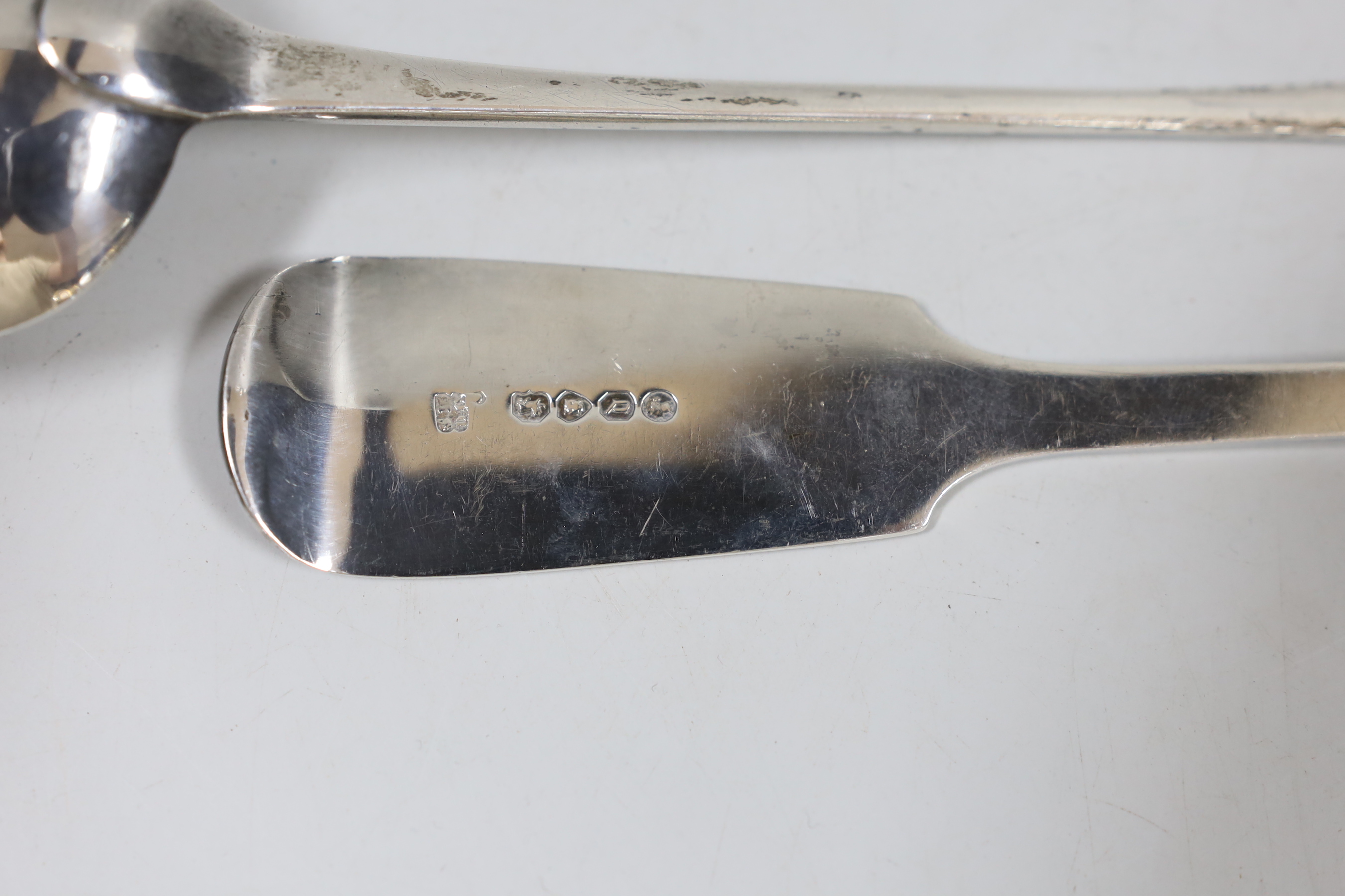 A George III Old English pattern basting spoon, London, 1811, 29.4cm and a later silver fiddle pattern basting spoon, London, 1859, 7.8oz.